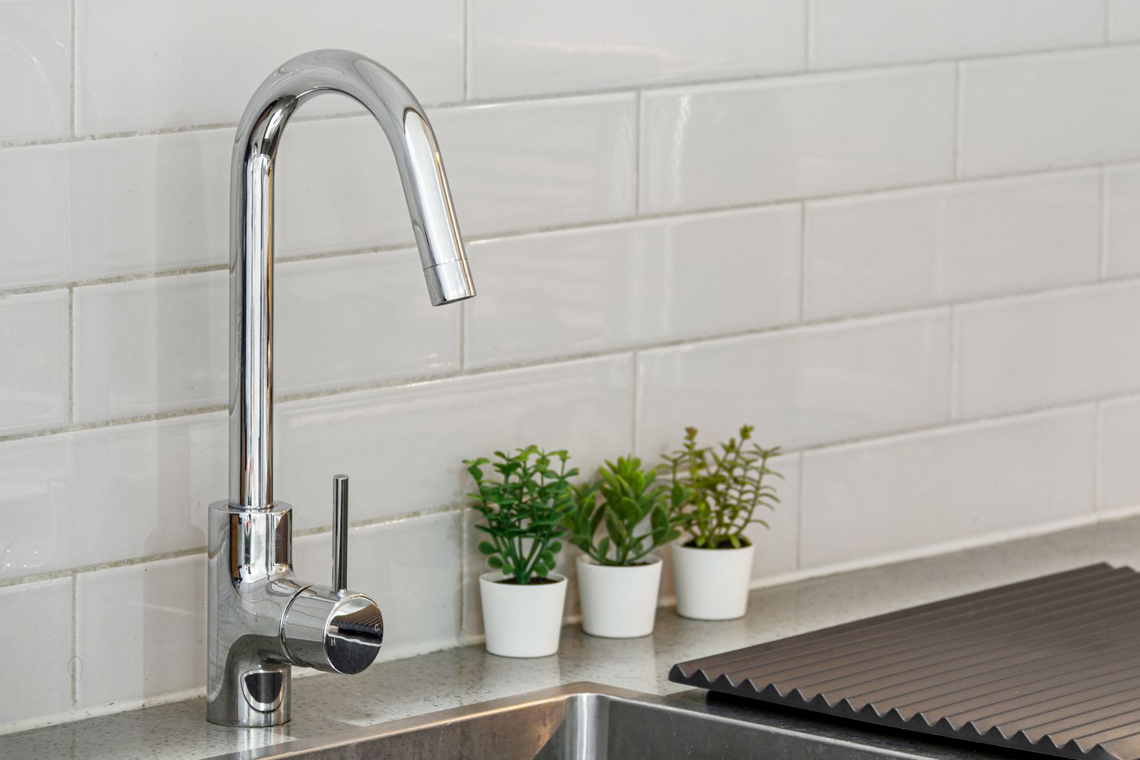 Kitchen sink with chrome faucet